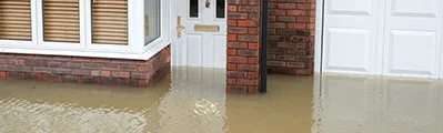Flood water surrounds a home.
