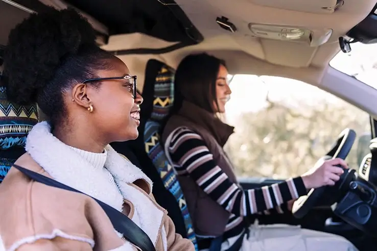 two young women in a camper van