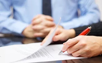 two people reviewing paperwork