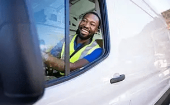 Smiling man driving van